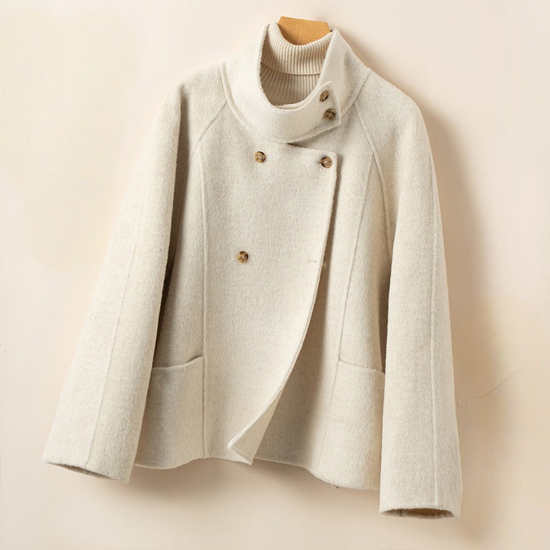 Women's double breasted relaxed wool coat with stand collar, classic tailored silhouette in neutral tone