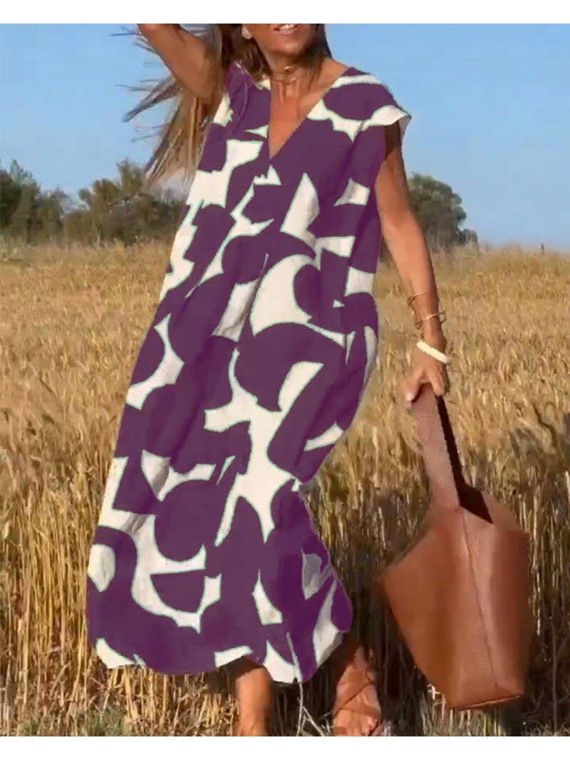 Women's relaxed abstract print dress, loose airy silhouette with bold contemporary pattern for vacation