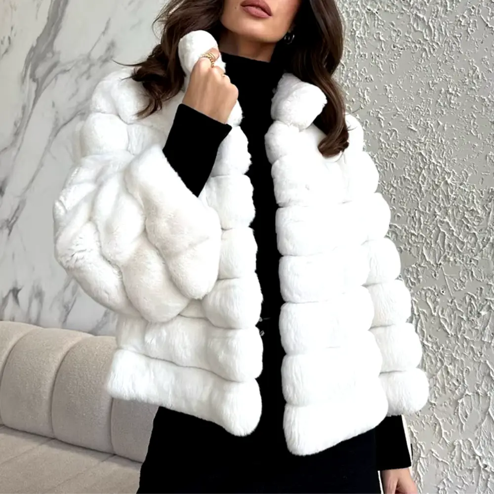 Women's cream faux fur boxy coat with plush texture and soft interior lining for luxurious warmth