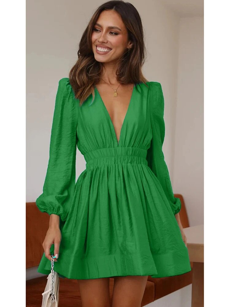 Black fit-and-flare mini dress deep V-neck sculpted puff shoulders stretch rayon blend day-to-night