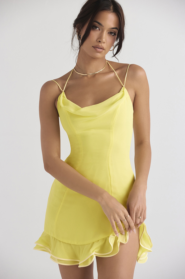 Black fitted cocktail dress with spaghetti straps, cowl neck, and flirty ruffle hem by Urbann-Vibe