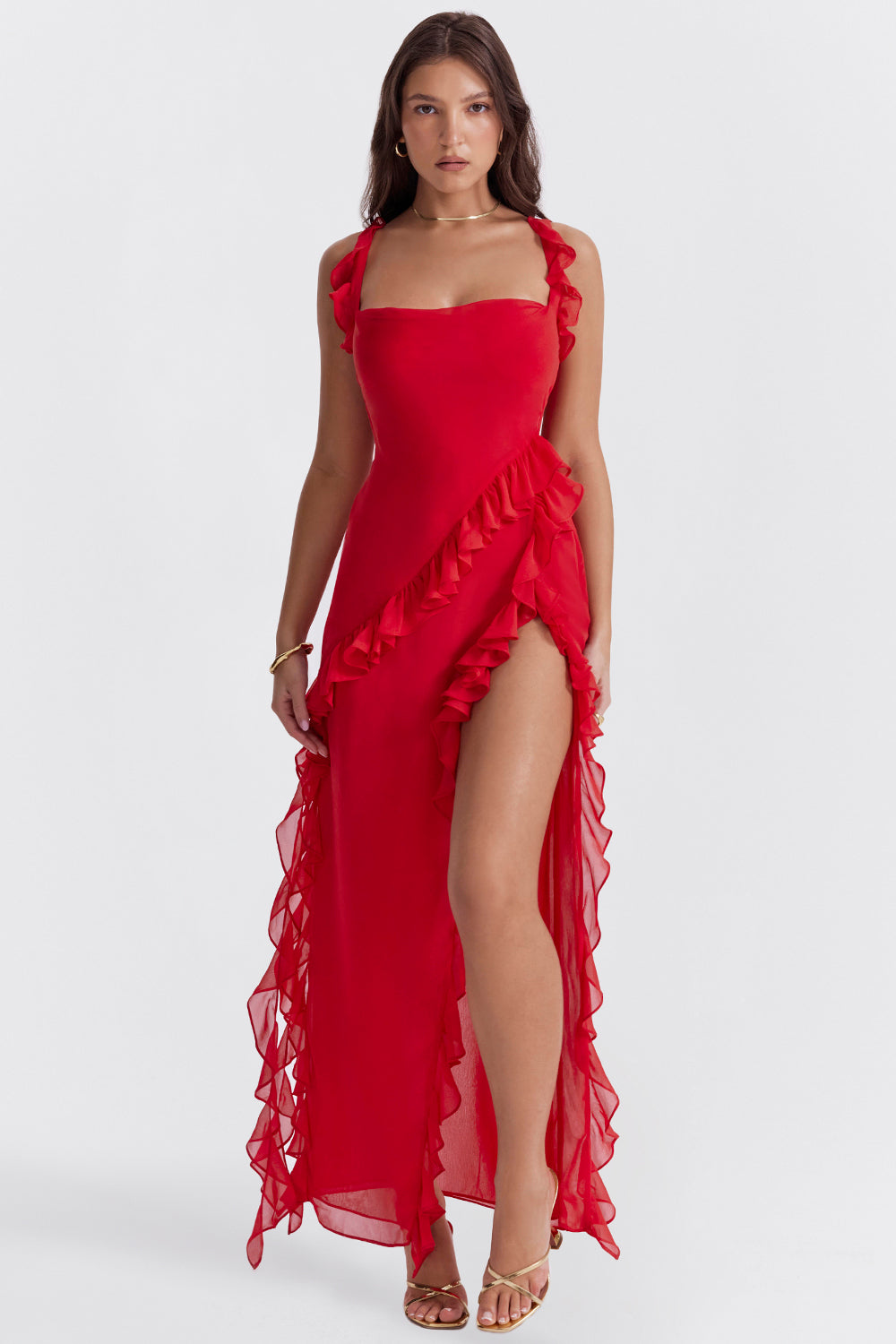 Melantha black ruffled maxi dress with adjustable straps, high slit, and asymmetrical ruffles for evening wear