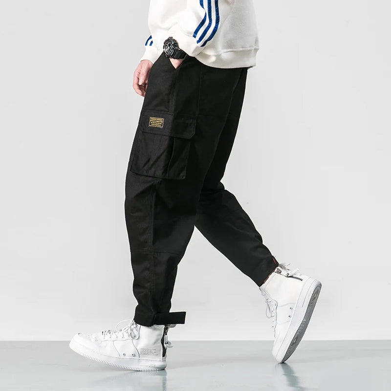 Phoenix black tapered cargo jogger pants with deep side pockets and adjustable streetwear fit