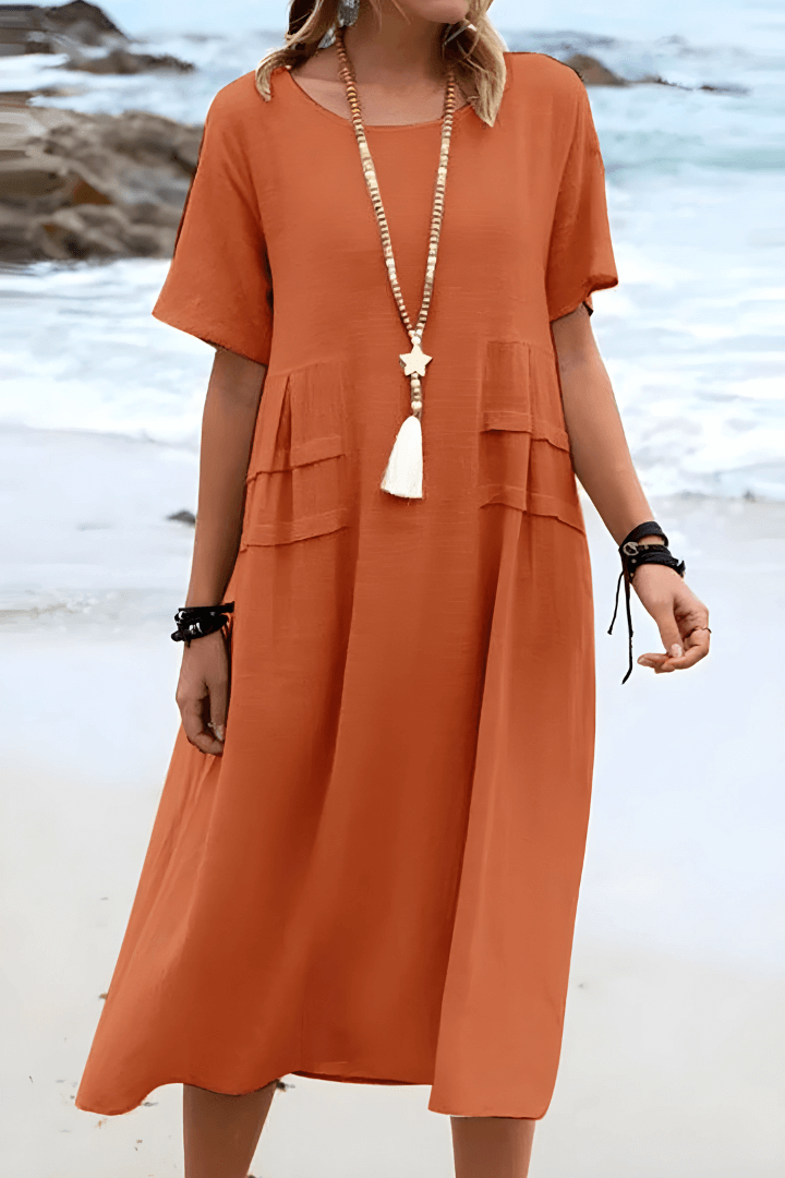 Women's relaxed fit linen dress in natural tones, breathable cotton blend with functional pockets