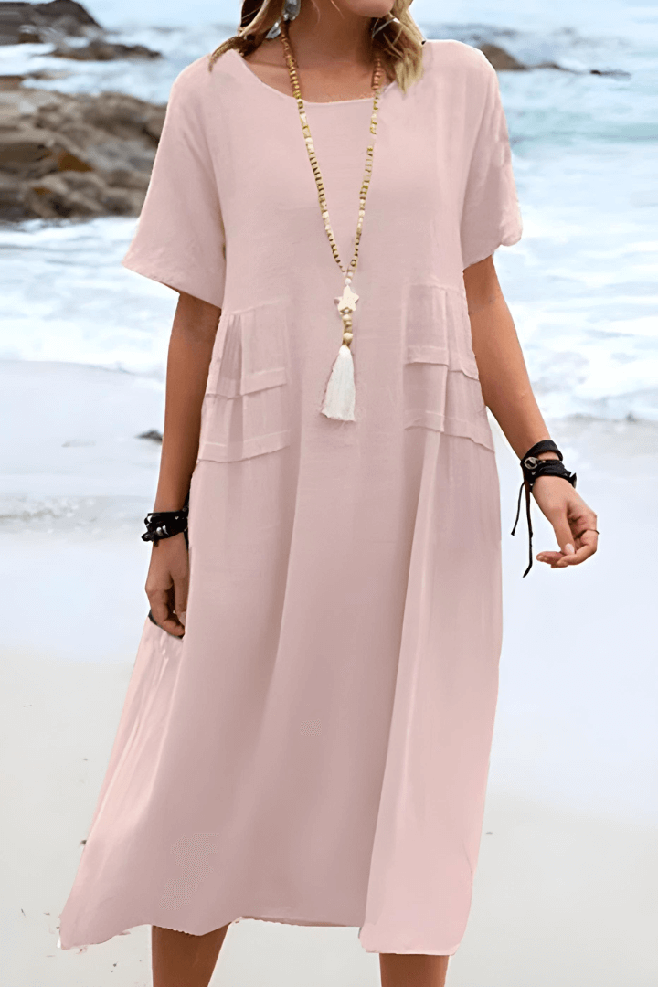 Women's relaxed fit linen dress in casual everyday style with practical side pockets