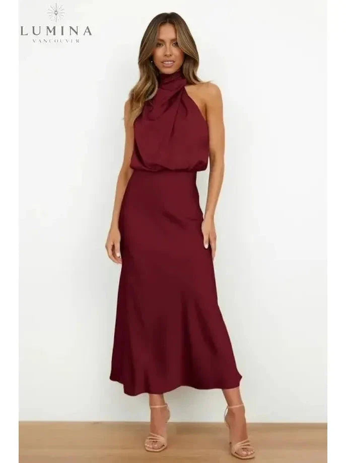 Black off-shoulder cocktail dress with lustrous finish, refined silhouette for glamorous eveningwear