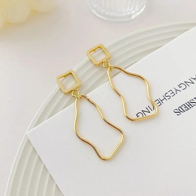 Asymmetric baroque pearl earrings with gold accents, lightweight modern chic statement jewelry for women