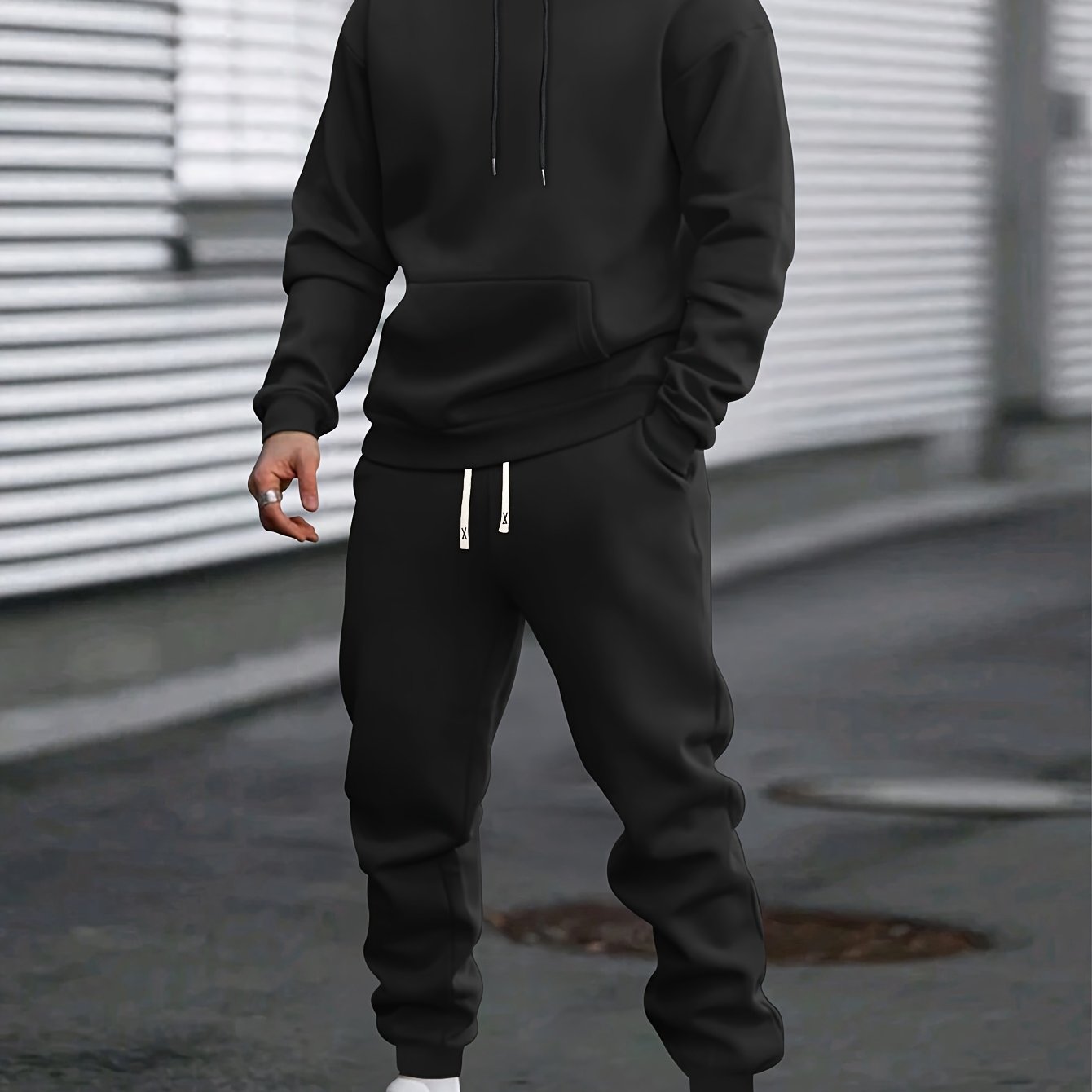 Men's gray pullover hoodie and jogger tracksuit set with drawstring hood and elastic waistband