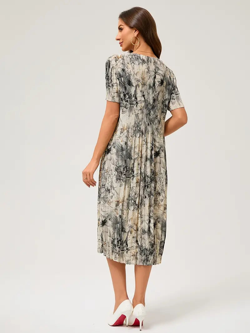 Women's pleated summer dress elegant floral print flowing feminine silhouette lightweight breathable fabric