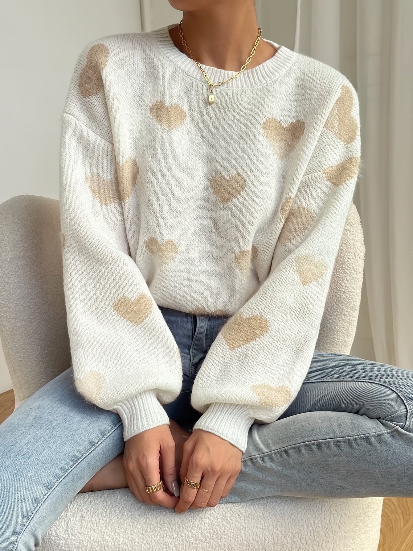 Cozy loose fit women's knit sweater with heart pattern design in soft casual style