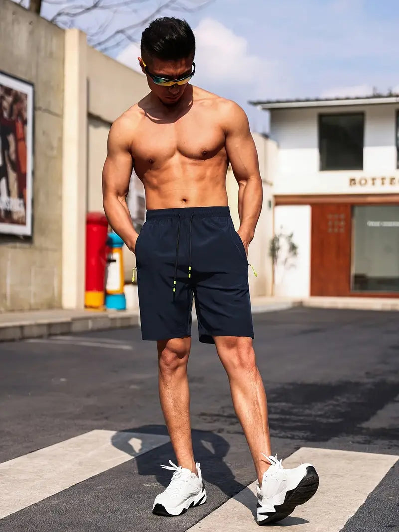 Men's gray athletic shorts slim fit lightweight breathable fabric with secure zippered pockets