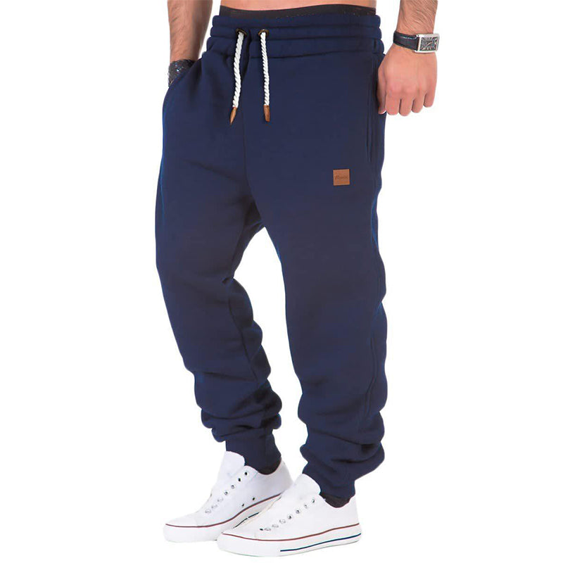 Men's gray fleece sweatpants with drawstring elastic waistband, relaxed fit for all-day comfort