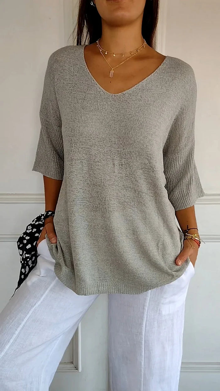 Women's beige knit tank top with flattering V-neckline and comfortable everyday versatile fit