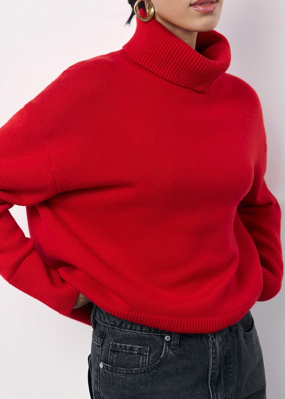 Red oversized turtleneck sweater women dropped shoulders relaxed knit silhouette layering staple
