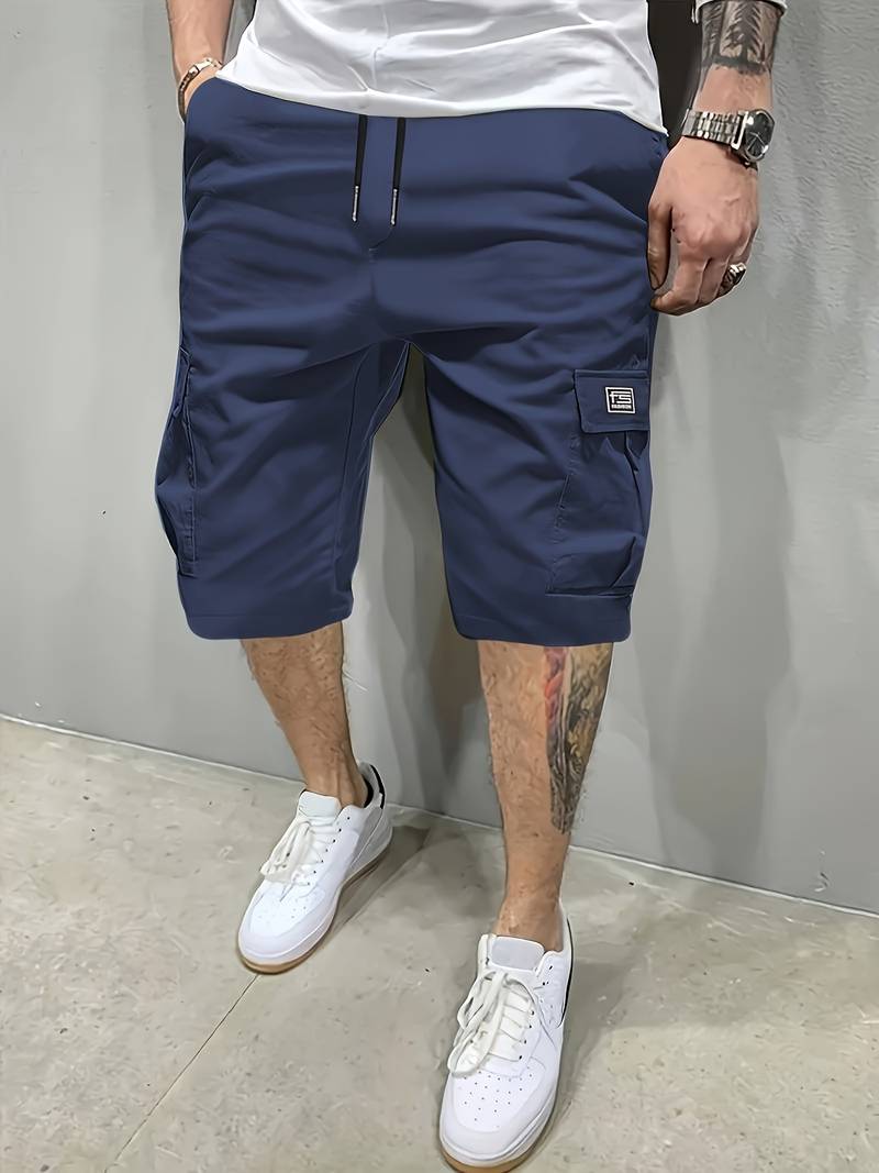 Men's palm tree graphic shorts in vibrant tropical print, relaxed comfort fit for beach and casual summer wear