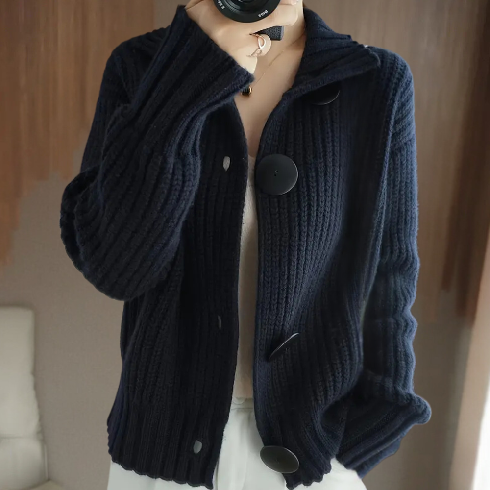 Women's thick knit wool cardigan in neutral tone, buttoned front, cozy structured silhouette
