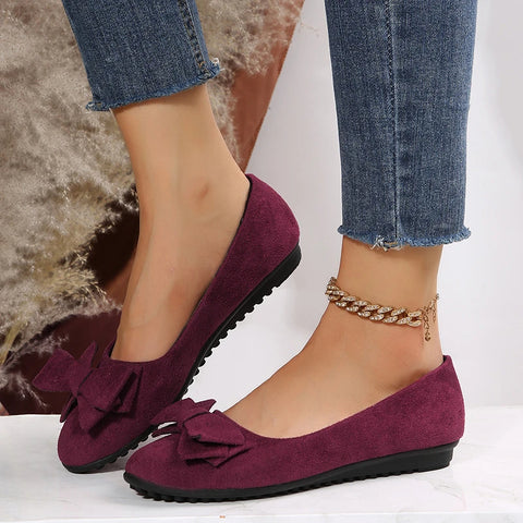 Women's classic ballet flats with elegant bow accent, comfortable everyday spring shoes in timeless silhouette