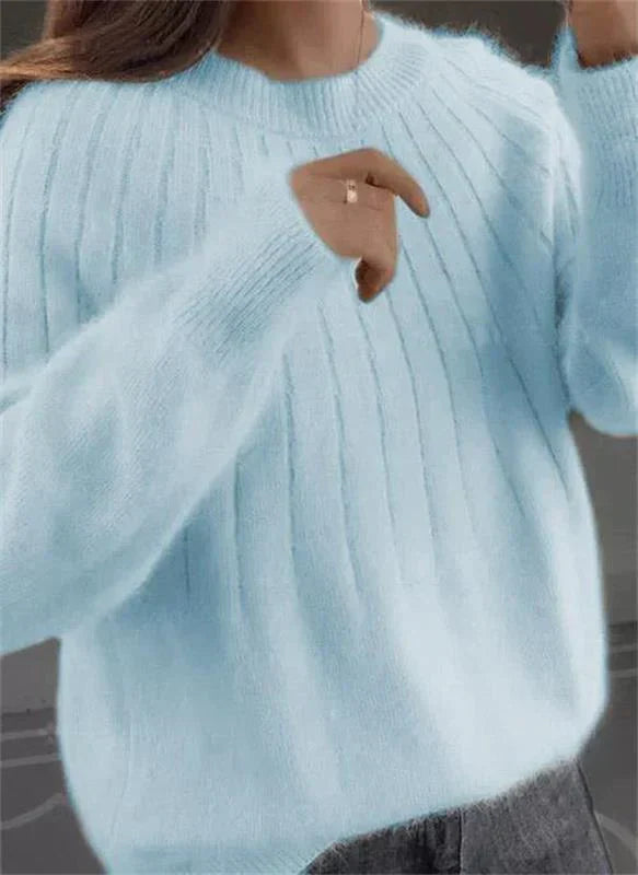 Women's fluffy knit sweater in soft neutral tone, vertical ribbed texture, cashmere-like cozy fit
