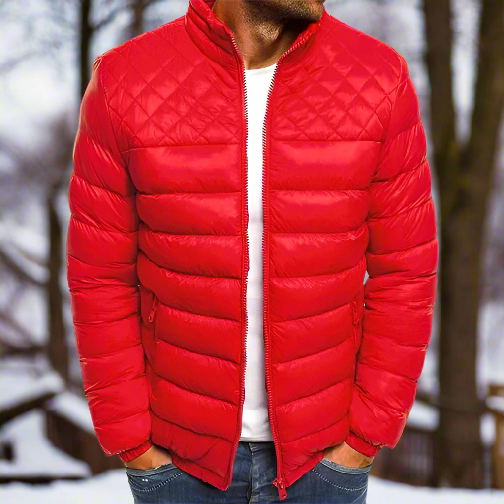Men's navy quilted hip-length jacket with high collar, zip front, and classic diamond stitching