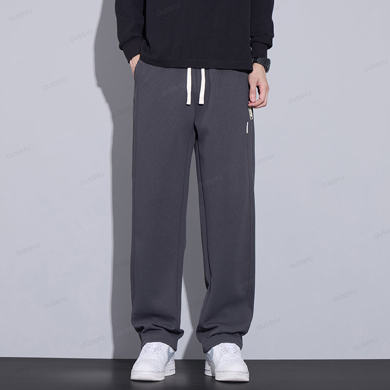 Men's gray waffle knit hiking pants with elastic waist, built for outdoor adventures and casual wear