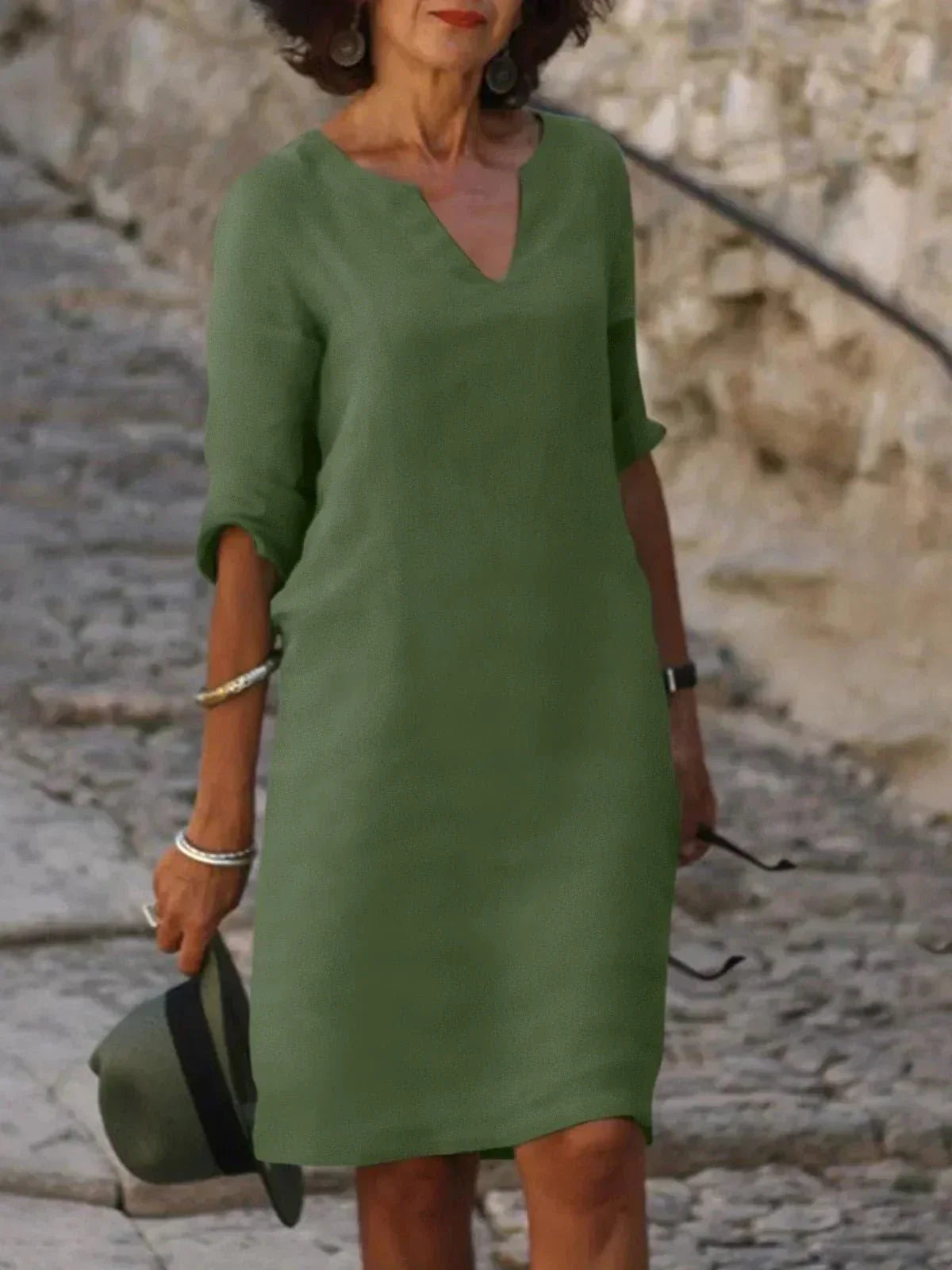 Women's relaxed V-neck dress in casual style with flattering elongating neckline and loose silhouette