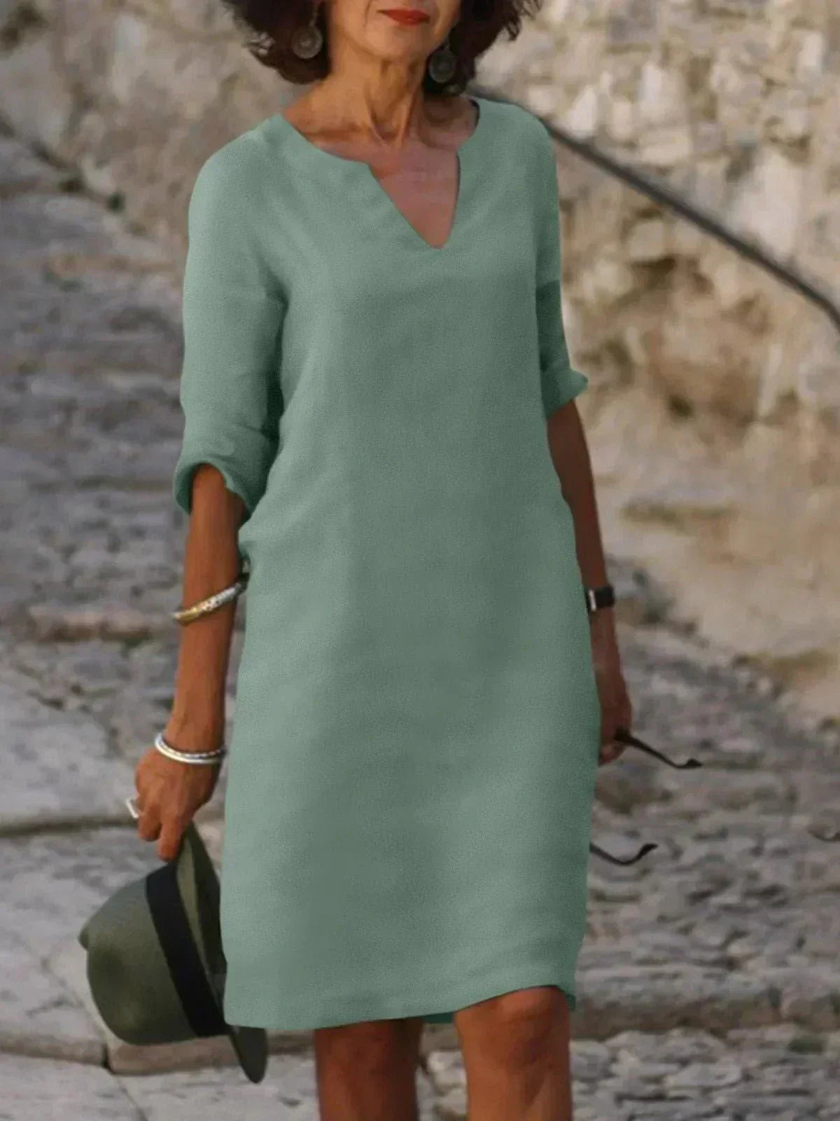 Women's relaxed v-neck midi dress with fluid draping and three-quarter sleeves for effortless everyday wear