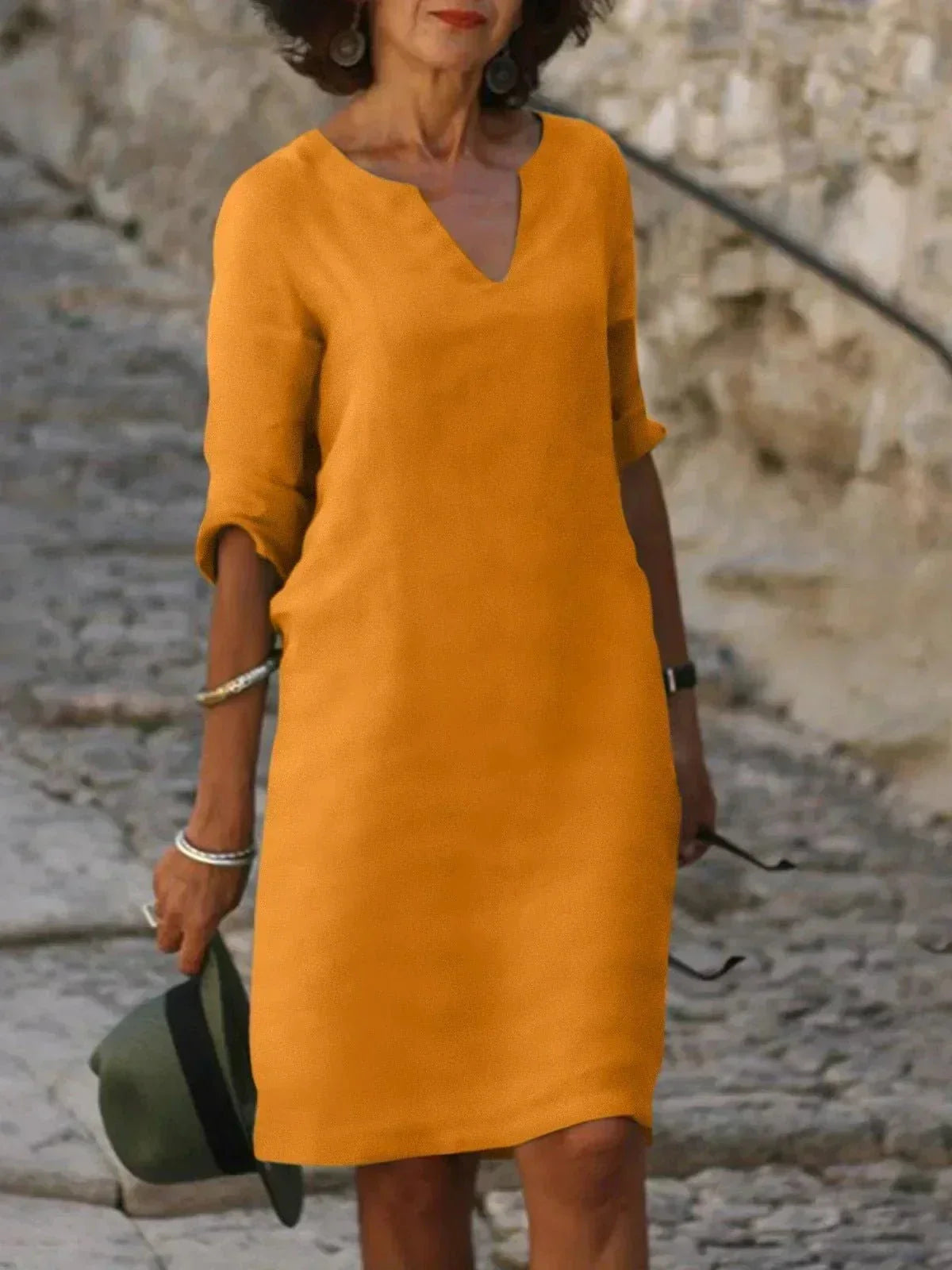 Women's relaxed V-neck dress in casual silhouette with flattering elongating neckline
