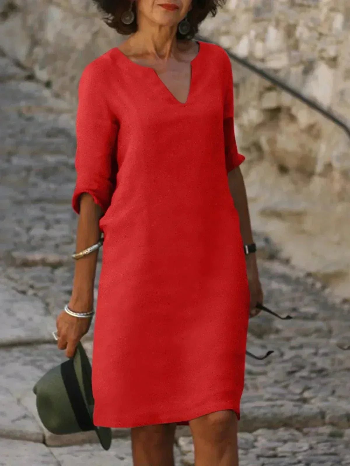 Women's relaxed V-neck dress in casual style with flattering elongating neckline and loose tailored fit