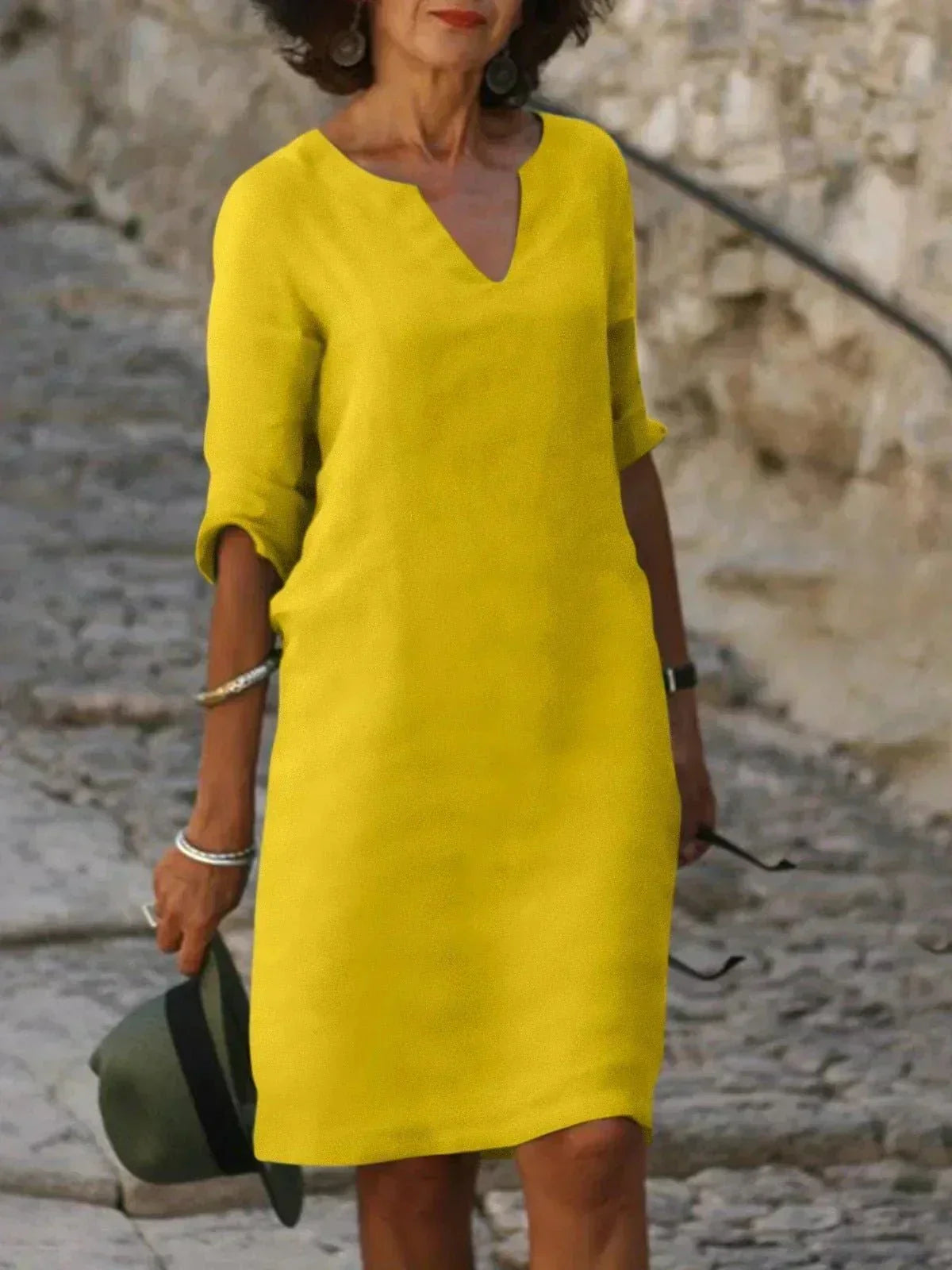 Women's relaxed v-neck midi dress with fluid draping and three-quarter sleeves for effortless everyday wear