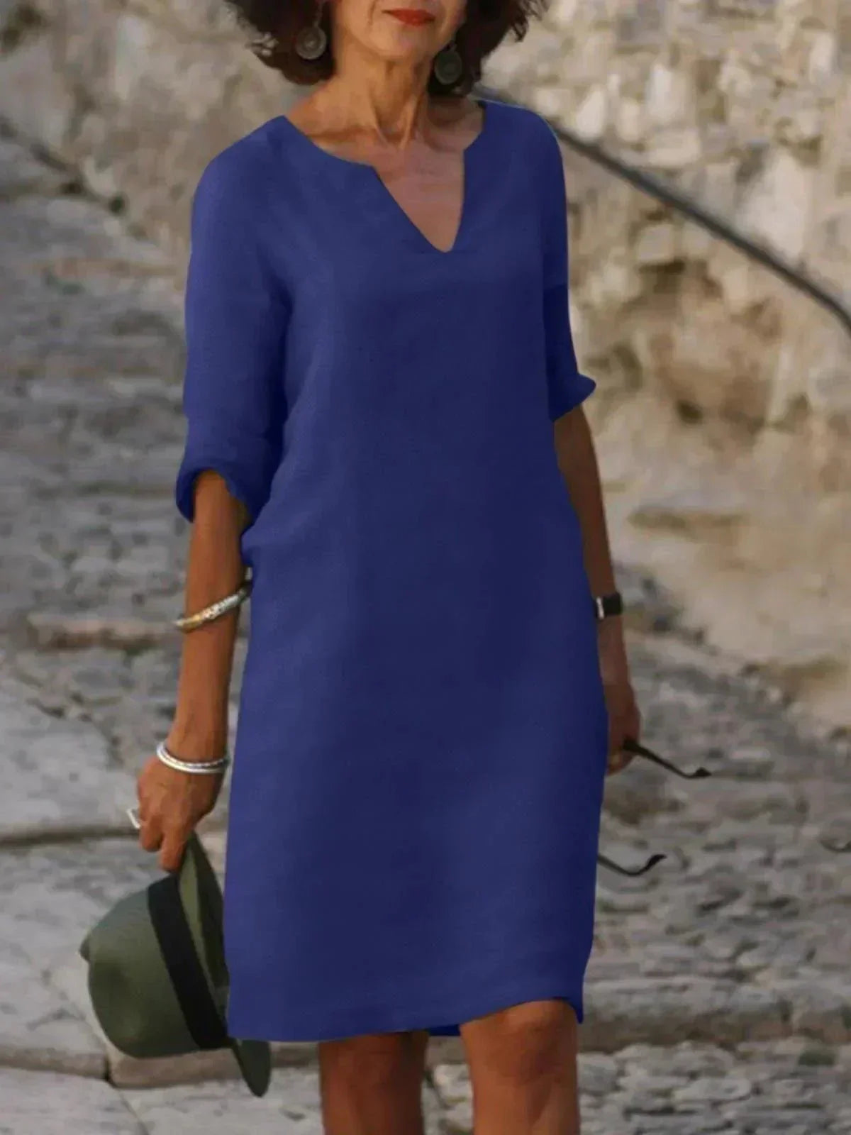 Women's relaxed midi dress with soft V-neck, fluid draping, and three-quarter sleeves for effortless style