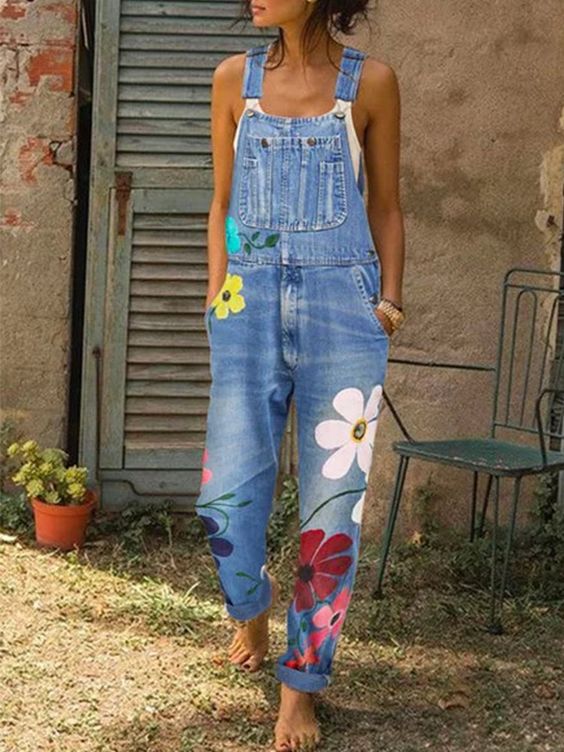 Women's sleeveless denim overalls with adjustable straps, front bib pocket, and rolled cuff casual fit
