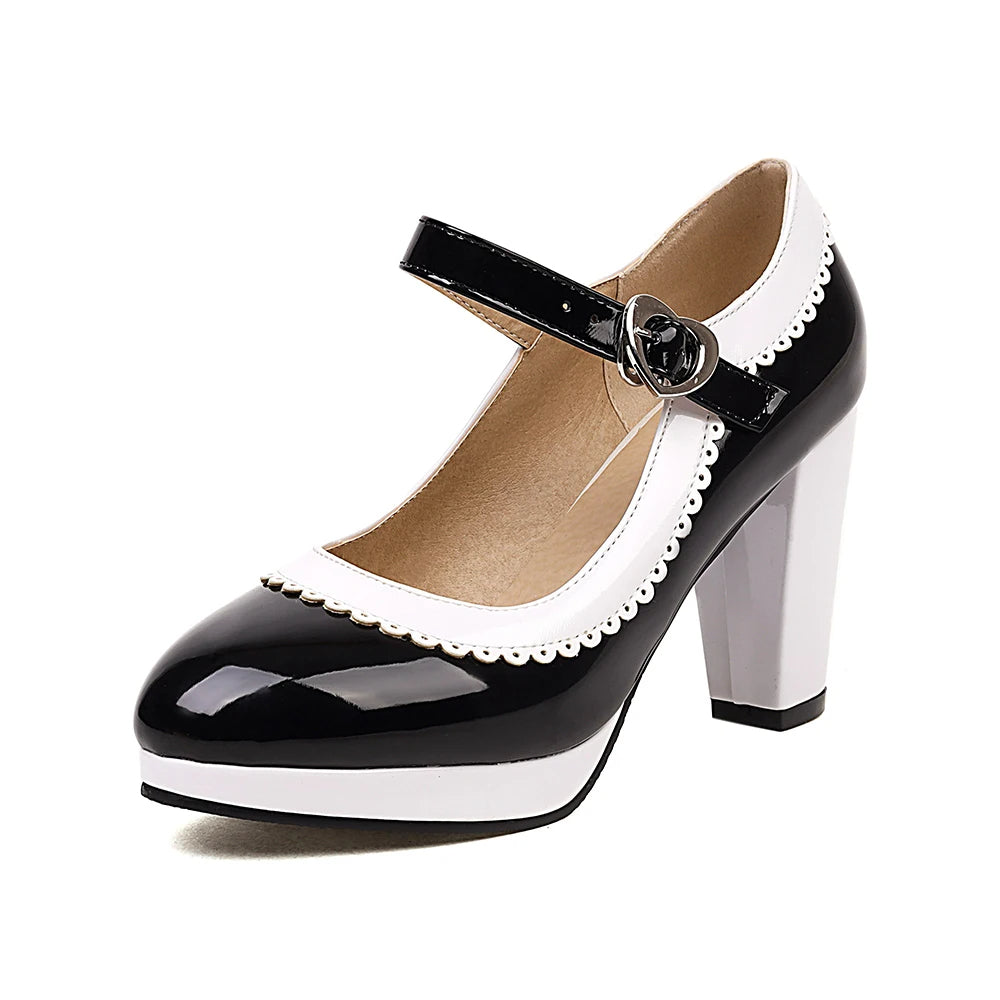 Black patent vegan leather Mary Jane heels with scalloped edges and heart buckle retro style