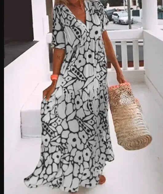 Women's loose fit print dress with airy silhouette and modern geometric pattern for warm days