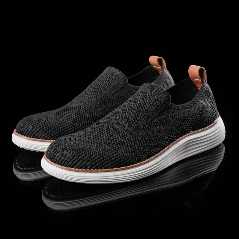 Men's gray breathable slip-on walking sneakers with lightweight design and modern silhouette