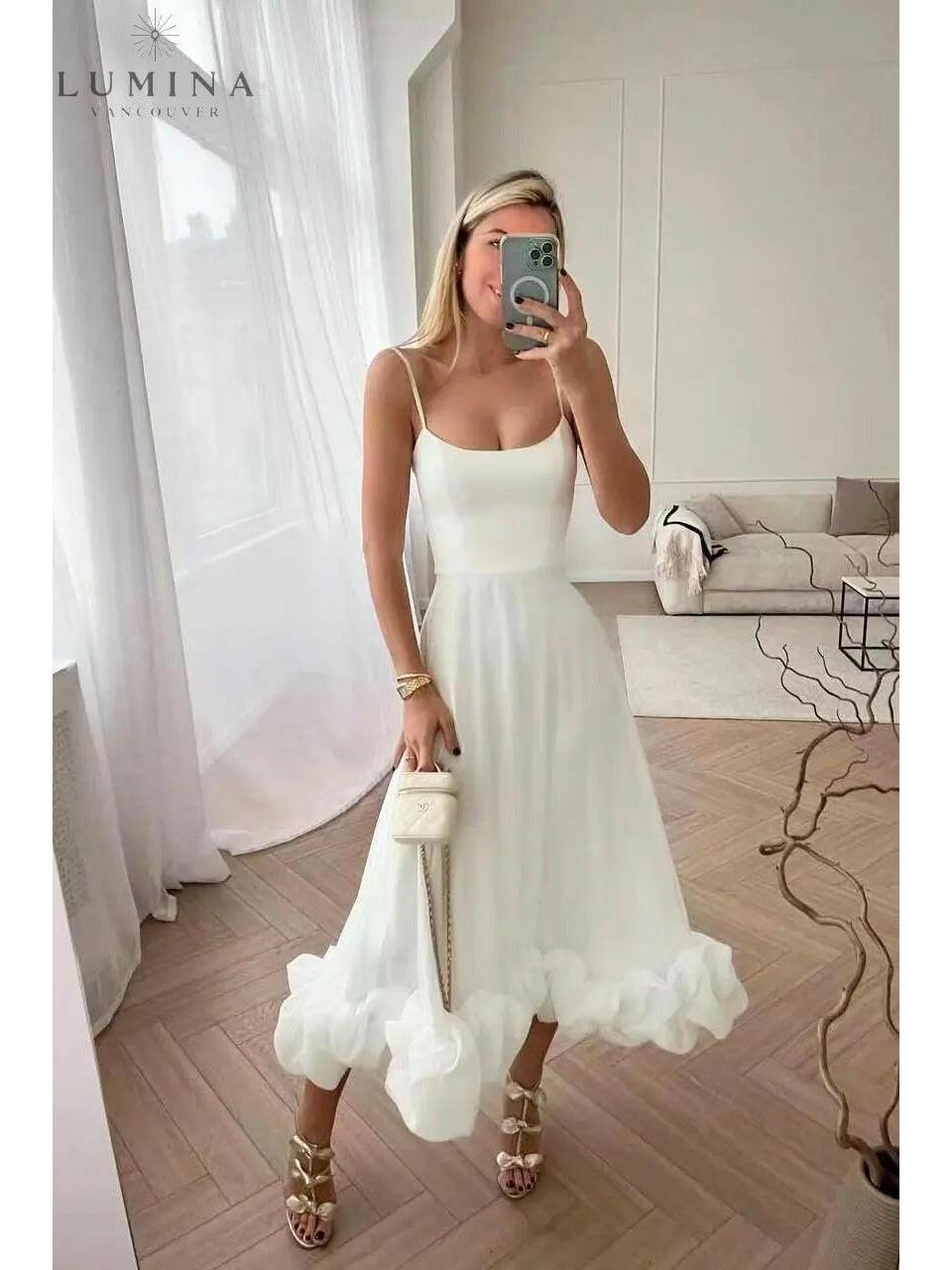 Women's elegant flowing maxi dress in soft hues with graceful silhouette perfect for wedding guest occasions