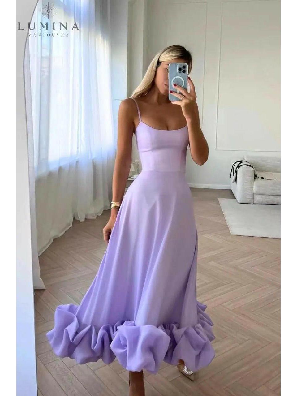 Women's elegant flowing maxi dress in soft hues with graceful silhouette perfect for wedding guest occasions