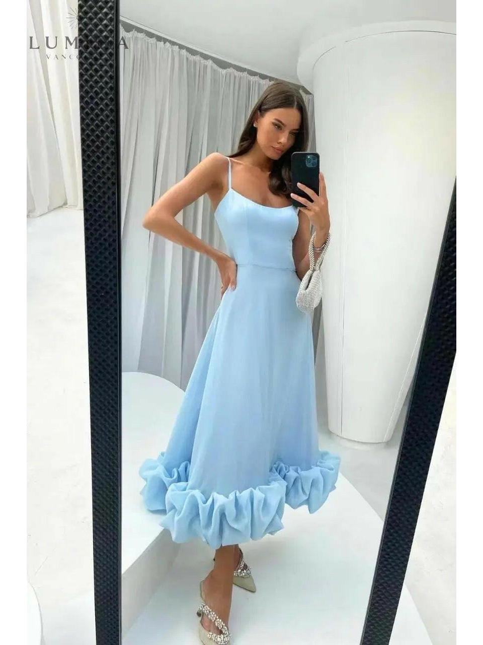 Women's elegant flowing dress in soft hues with graceful silhouette perfect for wedding guest occasions