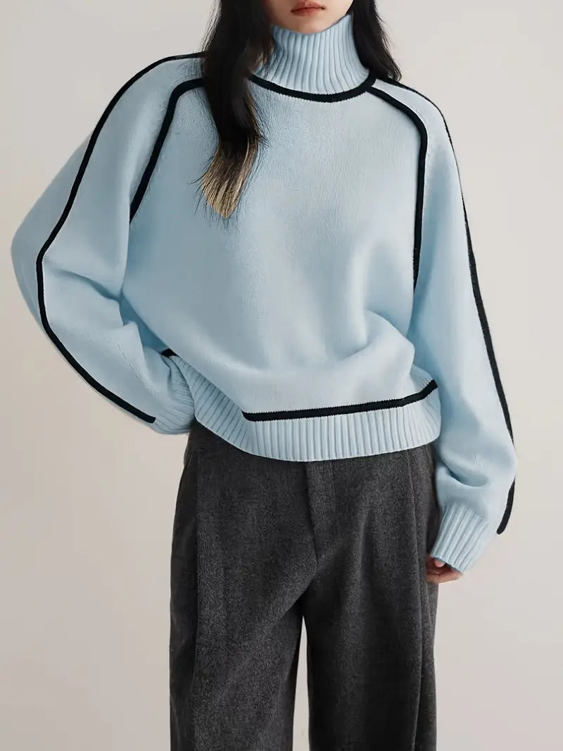 Ivory knit turtleneck sweater with black contrast trim seams, sleek architectural cut for professionals