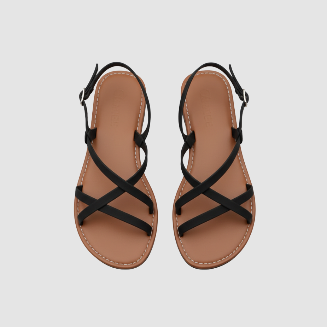 Women's crossed strap sandals with adjustable buckle in neutral tone, sleek modern silhouette