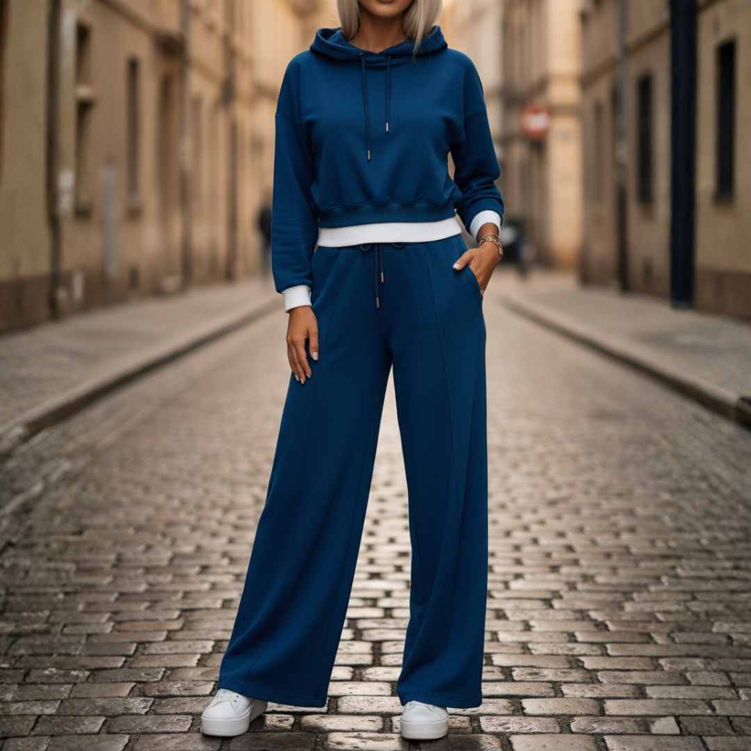 Women's soft two-piece hoodie and wide-leg pants set in neutral tone, relaxed fit for travel comfort
