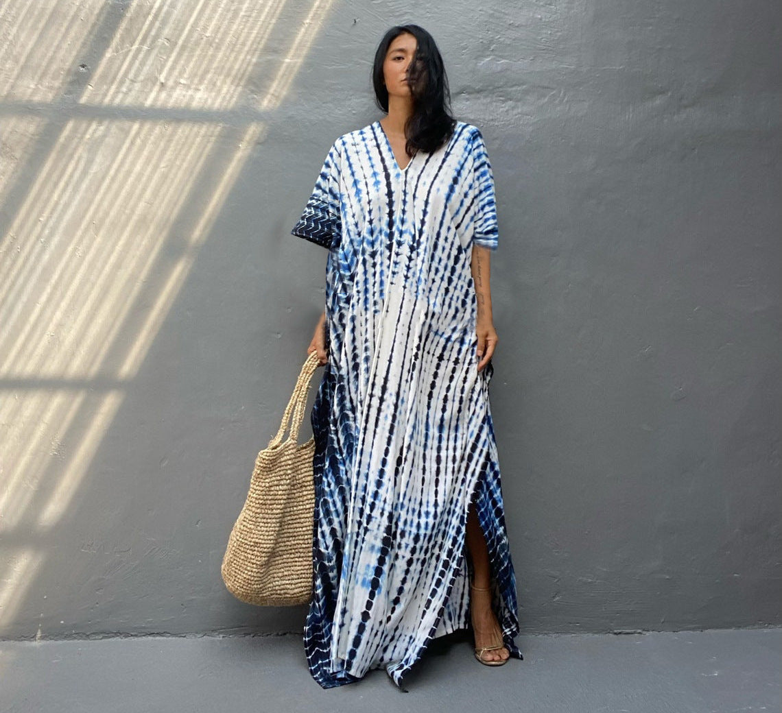 Women's boho tie-dye caftan maxi dress, V-neck loose fit with vibrant batik print for beach resort