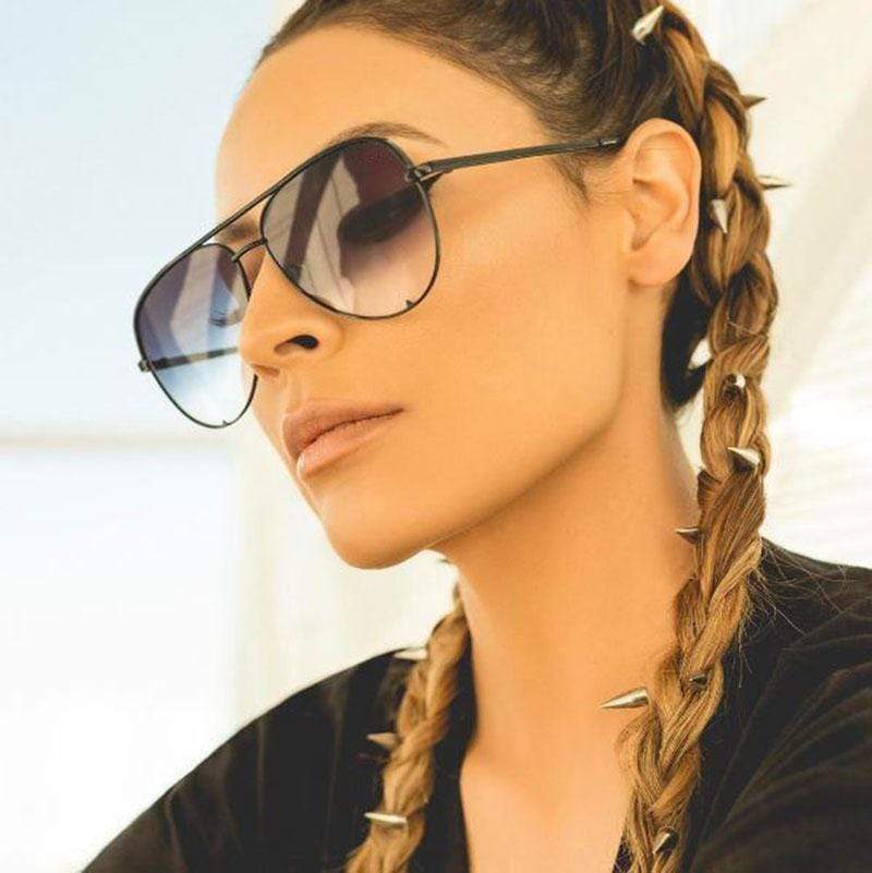 Women's aviator sunglasses with mirrored lenses in rose gold frame, bold reflective finish
