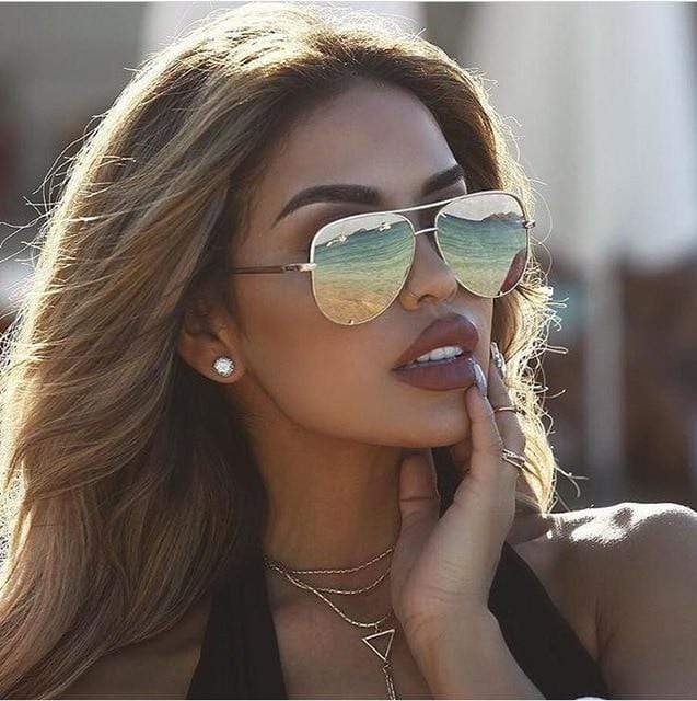 Women's aviator sunglasses with mirrored lenses, slim metal frame in rose gold for a bold retro look