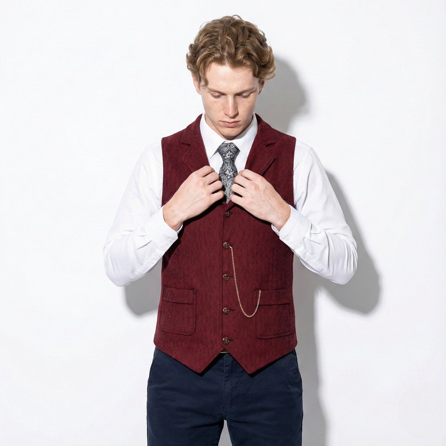 Men's brown tweed herringbone vest with notch lapel and six-button front formal style