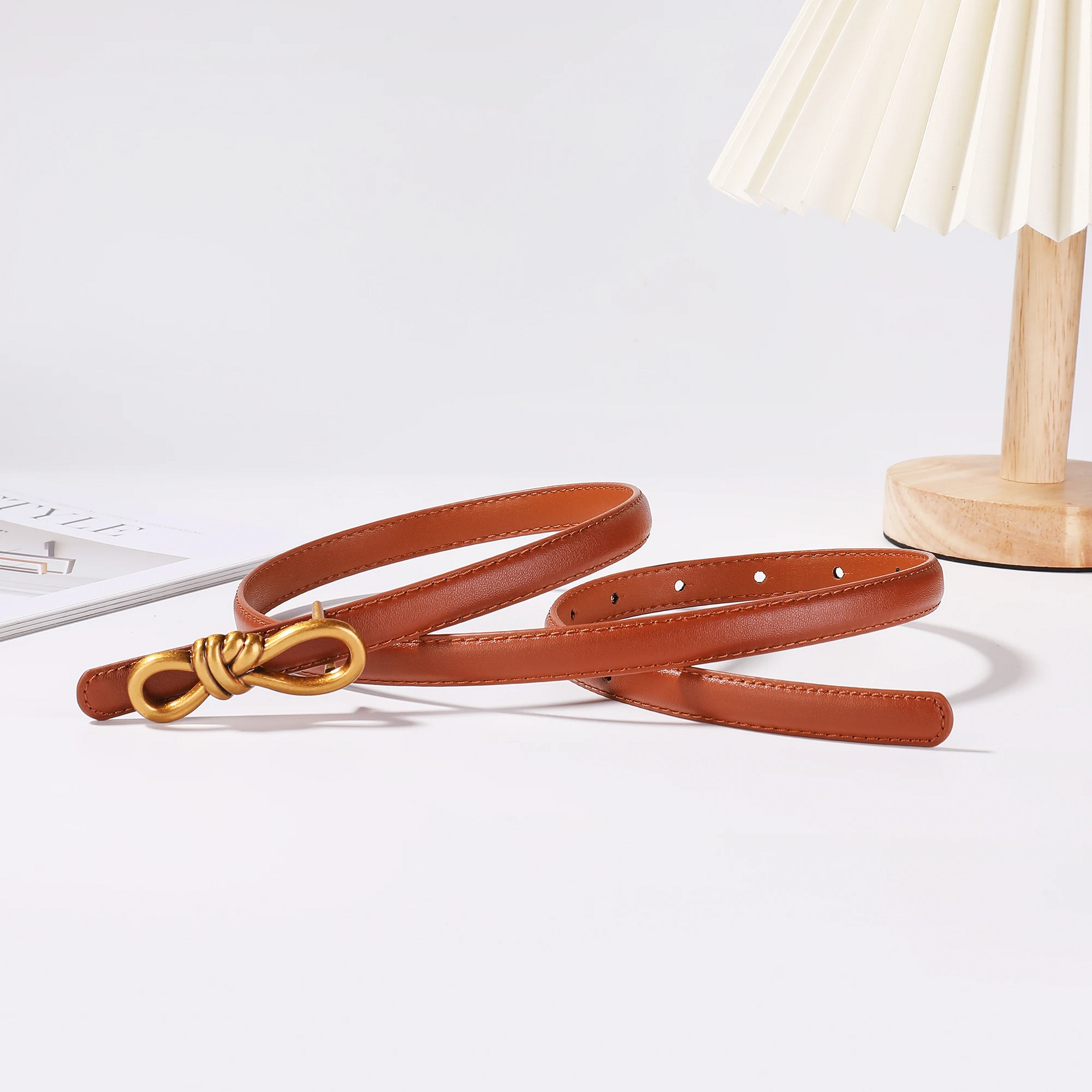 Women's genuine leather belt in tan with gold knot buckle, adjustable one-size elegant accessory