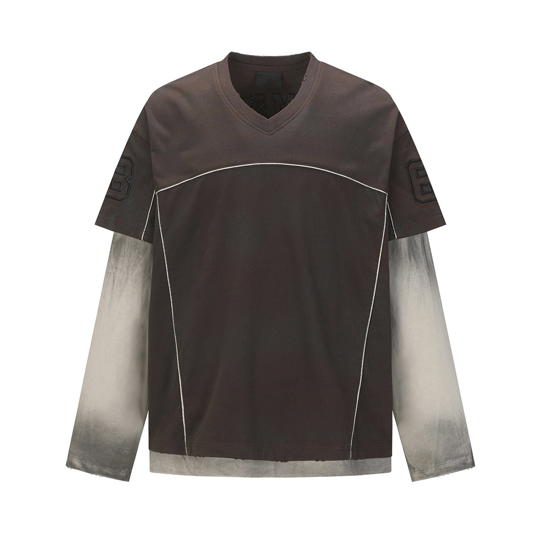 White cotton V-neck tee with spliced layered panels, distressed wash, and subtle embroidered accents