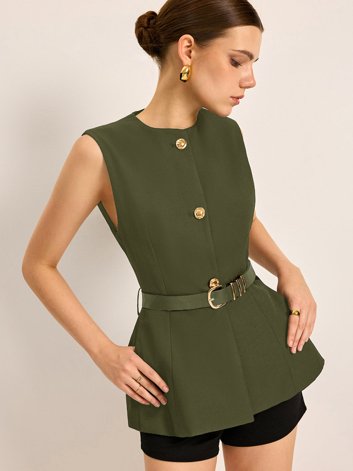 Women's sleeveless crew neck belted top with button accent pockets, polished work-to-casual style