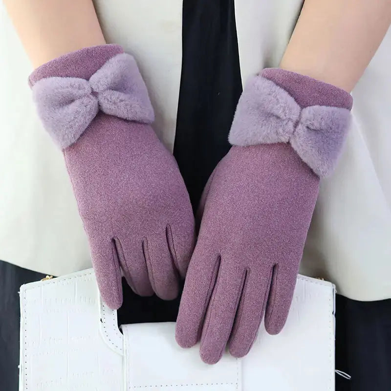 Women's black fleece-lined windproof winter gloves with touchscreen fingertips and bow detail