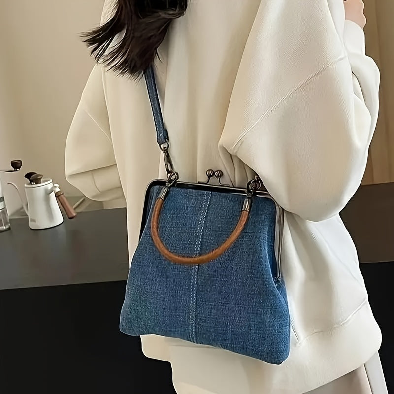 Premium denim shoulder bag with cowhide leather handle, frame-top silhouette, vintage-contemporary style