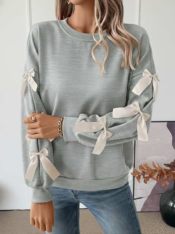 Women's loose hip-length Christmas bow sweatshirt, round neck, long sleeve cozy holiday casual top